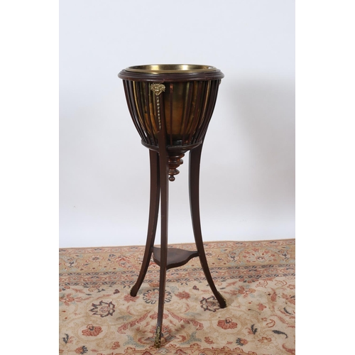 3 - A VINTAGE MAHOGANY AND GILT BRASS MOUNTED JARDINIERE STAND of circular tapering form with slatted up... 
