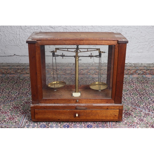 39 - A VINTAGE BRASS WEIGHING SCALES in mahogany and glazed case with frieze drawer 38cm (h) x 41cm (w) x... 
