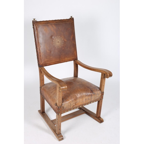 41 - AN ARTS AND CRAFTS ASH AND WALNUT INLAID ARMCHAIR with hide upholstered back and set and brass studs... 
