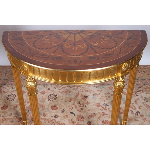 46 - A FINE PAIR OF CONTINENTAL KINGWOOD MARQUETRY AND GILT SIDE TABLES each of demilune outline the shap... 