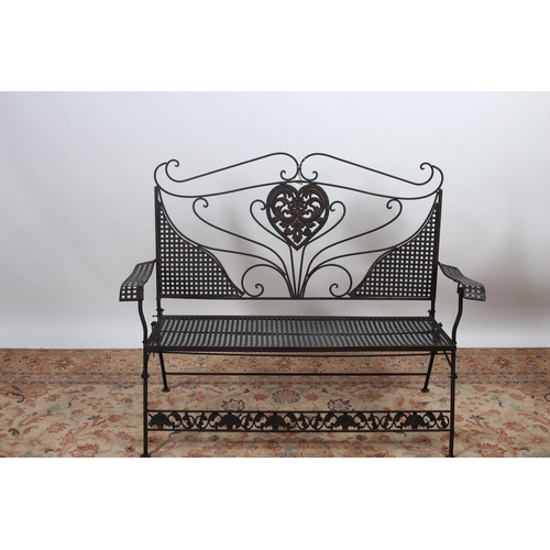 571 - A WROUGHT IRON TWO SEATER FOLDING SEAT with scroll and lattice work back and seat on cylindrical leg... 