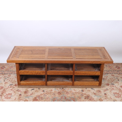 573 - A TEAK BENCH with slatted seat with six slide trays 45cm (h) x 138cm (w) x 50cm (d)