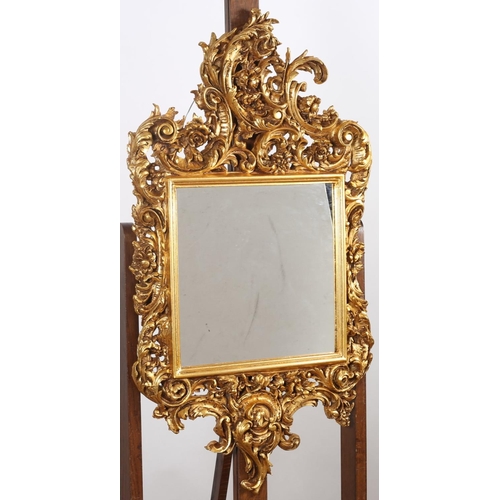 578 - A PAIR OF CONTINENTAL GILT FRAME MIRRORS the rectangular plates within C-scroll pierced and flowerhe... 