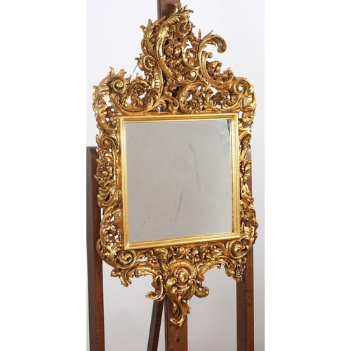 578 - A PAIR OF CONTINENTAL GILT FRAME MIRRORS the rectangular plates within C-scroll pierced and flowerhe... 