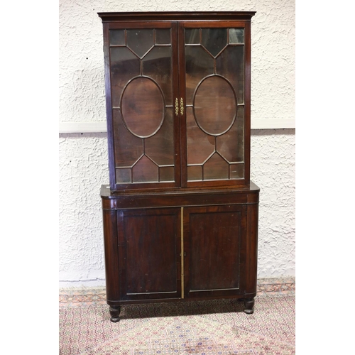 581 - A 19TH CENTURY MAHOGANY LIBRARY BOOKCASE the moulded cornice above a pair of astragal glazed doors t... 