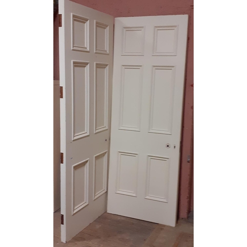 596 - A PAIR OF SOLID MAHOGANY CREAM PAINTED SIX PANEL DOORS 218cm (h) x 82cm (w) x 5.50cm (d)