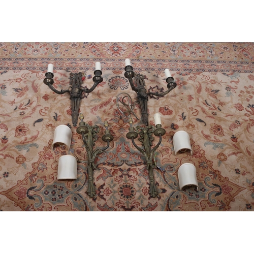 598 - A PAIR OF BRASS TWO BRANCH WALL LIGHTS each with a ribbon tied foliate back plate issuing two leaf c... 