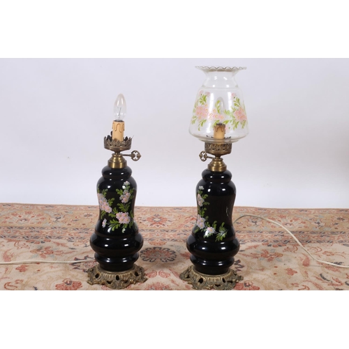 6 - A PAIR OF BRASS AND GLAZED TABLE LAMPS each decorated with floral sprays above a pierced rococo base... 