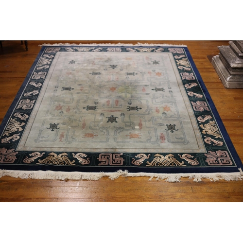 60 - A CHINESE WOOL RUG the light green and light blue ground with central panel filled with serrated pan... 