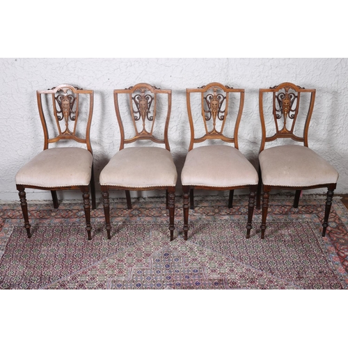 600 - A SET OF FOUR EDWARDIAN ROSEWOOD AND MOTHER OF PEARL INLAID SIDE CHAIRS each with a shaped top rail ... 