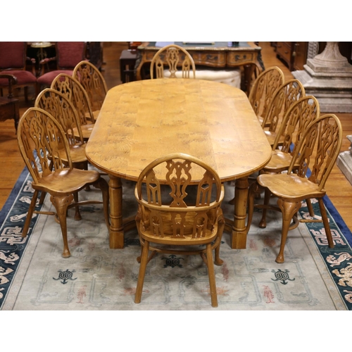 68 - AN ELEVEN PIECE THAMES VALLEY MAPLE BREAKFAST SUITE comprising ten chairs each with a gothic tracery... 