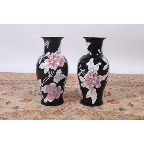 7 - A PAIR OF ORIENTAL VASES each of baluster form the black pink and light green ground decorated with ... 