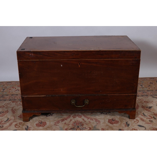 71 - A 19TH CENTURY MAHOGANY TRUNK the hinged top above a plain apron the base containing one long drawer... 