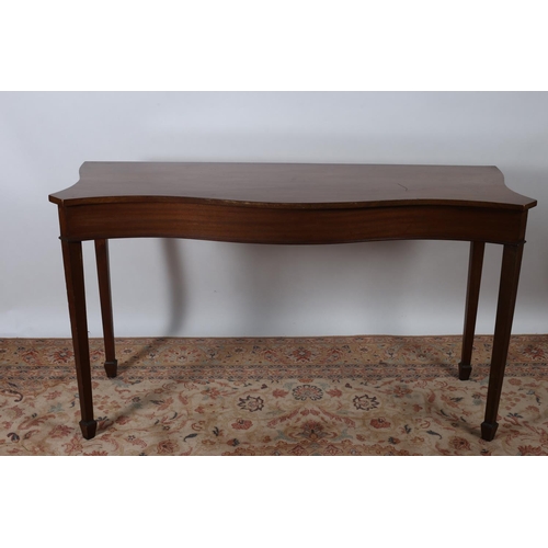 74 - A 19TH CENTURY MAHOGANY SIDE TABLE of serpentine outline the shaped top with moulded frieze on squar... 