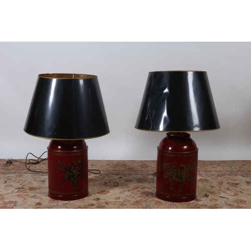 79 - A PAIR OF TOLEWARE TABLE LAMPS each of cylindrical form the wine ground decorated with musical troph... 