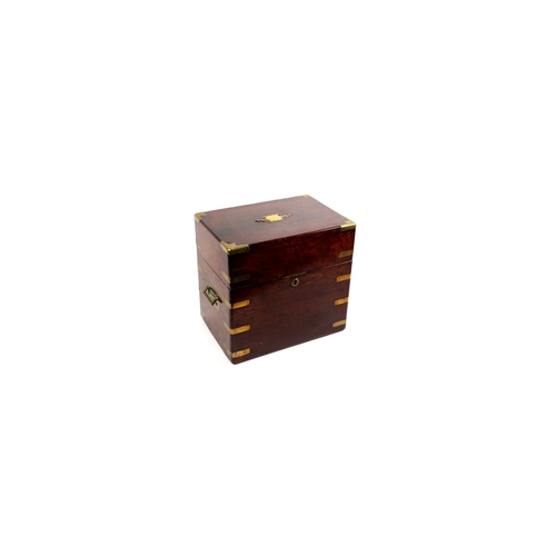 23 - A GEORGIAN MAHOGANY AND BRASS BOUND CELLARET the rectangular hinged lid with fitted interior and bra... 