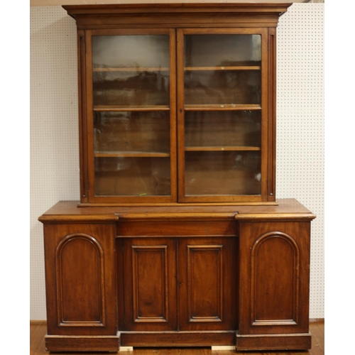 475 - A 19TH CENTURY MAHOGANY BOOKCASE on associated base the moulded cornice above glazed doors with adju... 