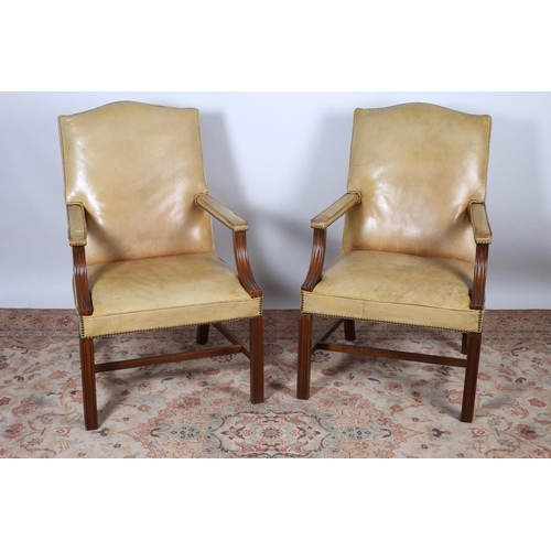 478 - A GOOD PAIR OF GAINSBOROUGH DESIGN MAHOGANY AND HIDE UPHOLSTERED ARMCHAIRS each of rectangular arche... 