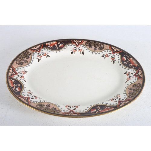 484 - A DOULTON IRONSTONE MEAT PLATTER of oval outline the white ground with gilt black and light pink dec... 