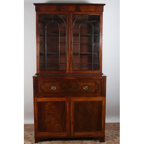 62 - A GEORGIAN MAHOGANY SECRETAIRE LIBRARY BOOKCASE the moulded cornice above a pair of astragal glazed ... 