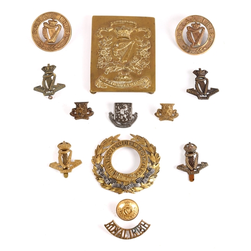 258 - Royal Irish Regiment small collection of badges and buttons, including a cross belt plate, cap badge... 