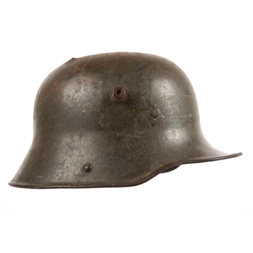 260 - 1914-1918 German M1918 stahlhelm, the helmet in original grey-green paint with most of liner, exit h... 