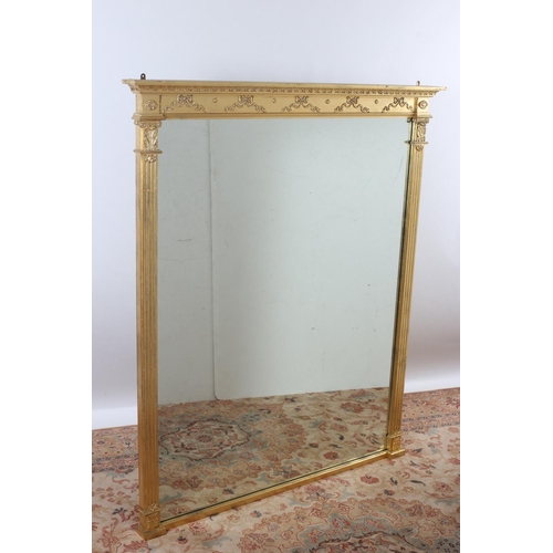15 - A REGENCY DESIGN GILTWOOD AND GESSO OVERMANTLE MIRROR the rectangular bevelled glass plate between f... 