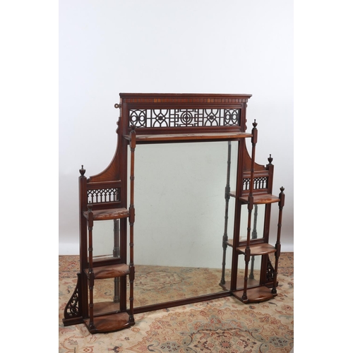 17 - A VINTAGE MAHOGANY OVERMANTLE MIRROR with fretwork cresting above a bevelled glass mirror flanked by... 