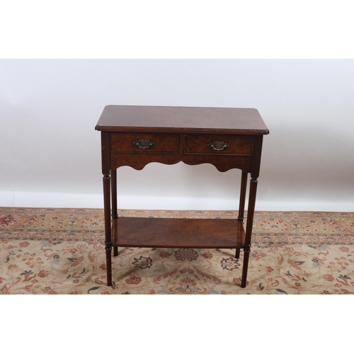 18 - A WALNUT SIDE TABLE of rectangular outline with two frieze drawers raised on turned moulded legs joi... 
