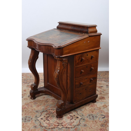 30 - A VICTORIAN WALNUT DAVENPORT the superstructure with hinged fitted compartment above a hinged writin... 
