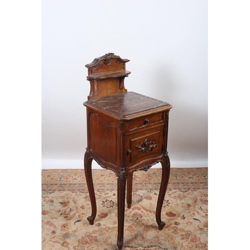 32 - A 19TH CENTURY CARVED WALNUT PEDESTAL the superstructure with moulded shelf above a veined marble in... 