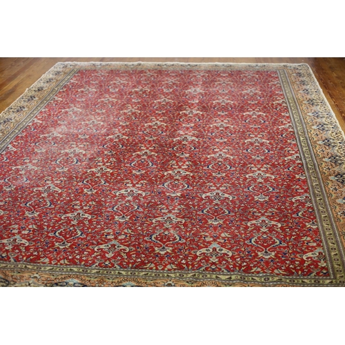 39 - AN ORIENTAL WOOL RUG the red light green and light pink ground with central panel filled with styliz... 