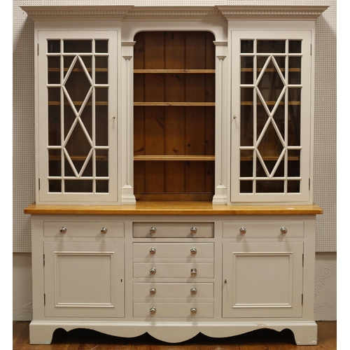42 - A CHALON PINE AND PAINTED DRESSER of inverted breakfront outline the dentil moulded cornice above fo... 