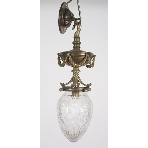 571 - AN ADAM DESIGN GILT BRASS AND CUT GLASS CENTRE LIGHT of ovoid tapering form hung with floral festoon... 