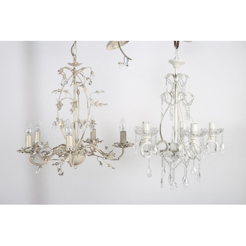 573 - TWO WROUGHT IRON FIVE BRANCH CHANDELIERS with scroll decoration hung with faceted chains and pendant... 