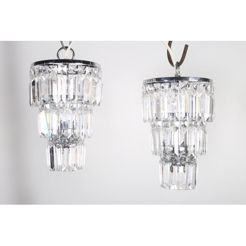 575 - A PAIR OF TIPPERARY CUT GLASS THREE LIGHT THREE TIER CENTRE LIGHT hung with faceted pendants 30cm dr... 