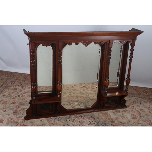 579 - A VINTAGE CARVED MAHOGANY OVERMANTLE COMPARTMENTED MIRROR the moulded cornice above bevelled glazed ... 