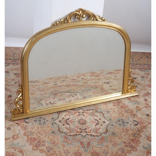 581 - A VICTORIAN DESIGN GILT FRAME MIRROR the rectangular arched bevelled glass plate within a moulded fr... 