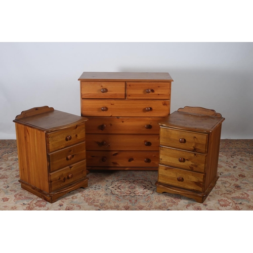 590 - A PINE CHEST with two short and four long drawers together with a pair of bedside chests containing ... 