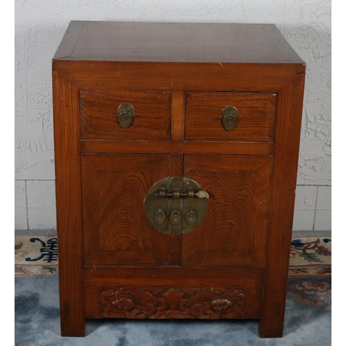 591 - AN ORIENTAL HARDWOOD SIDE CABINET the rectangular top above two frieze drawers and cupboards with br... 