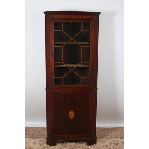6 - A 19TH CENTURY MAHOGANY AND SATINWOOD INLAID CORNER CABINET the dentil moulded cornice above an astr... 