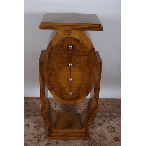 75 - AN ART DECO DESIGN WALNUT PEDESTAL of rectangular stepped outline containing four frieze drawers on ... 