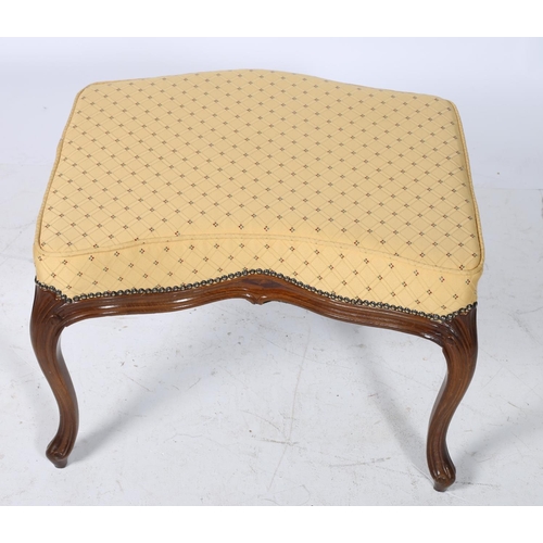 77 - A CONTINENTAL WALNUT AND UPHOLSTERED STOOL the serpentine seat above a moulded apron on cabriole leg... 