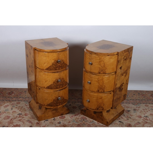 78 - A PAIR OF ART DECO DESIGN WALNUT CHESTS each of rectangular bowed outline the shaped tops above thre... 