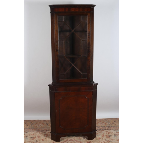 82 - A MAHOGANY CORNER CABINET the dentil moulded cornice above an astragal glazed door and cupboard on b... 