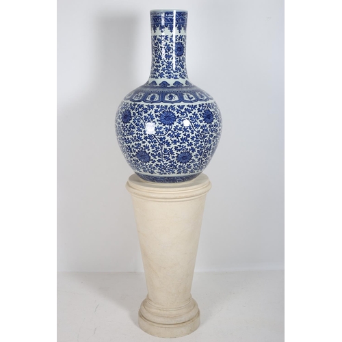 107 - A FINE ORIENTAL BLUE AND WHITE VASE of bulbous form decorated with stylized flowerheads and foliage ... 