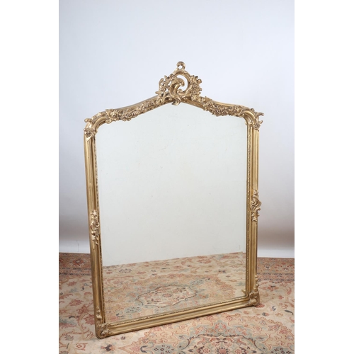 114 - A CONTINENTAL GILT FRAME MIRROR the rectangular arched bevelled glass plate within a moulded frame w... 