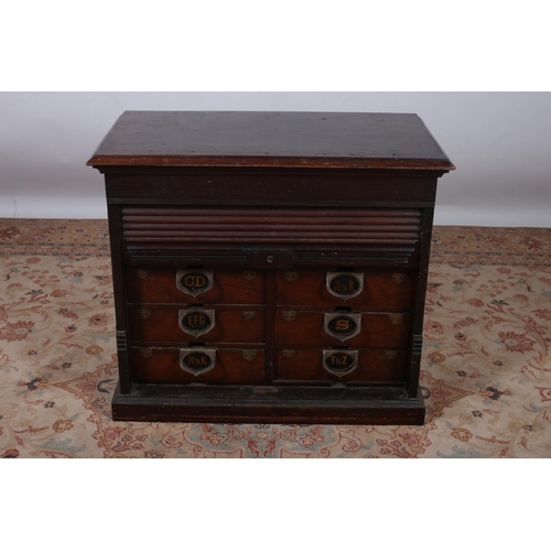 21 - A VINTAGE MAHOGANY FILING CABINET of rectangular outline with tambour shutter containing eight short... 