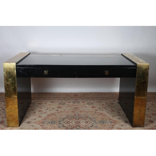 601 - A DESIGNER BLACK LACQUERED AND BRASS MOUNTED DESK of rectangular outline with two frieze drawers on ... 