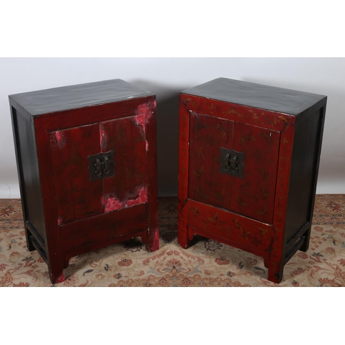 604 - A PAIR OF RED AND BLACK LACQUERED JAPANNED CUPBOARDS each of rectangular form with panelled doors an... 